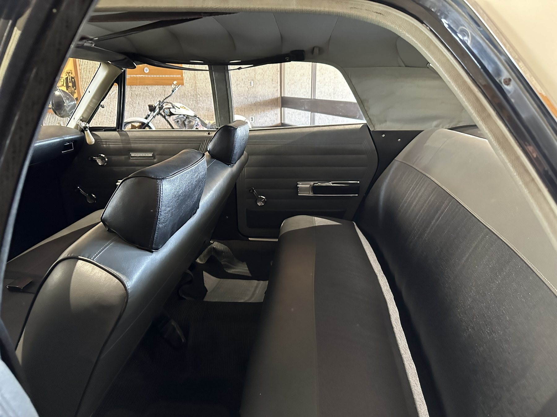 Rear compartment of a 1969 CHP Dodge Polara showing no prisoner partition